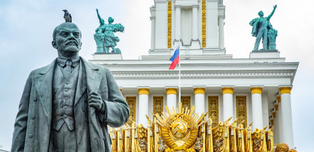 Moscow, Russia - October 19; 2022: Old sculpture of revolutionary Vladimir Lenin in soviet socialist VDNKH park. USSR coat of arms on a background.のeditorial素材