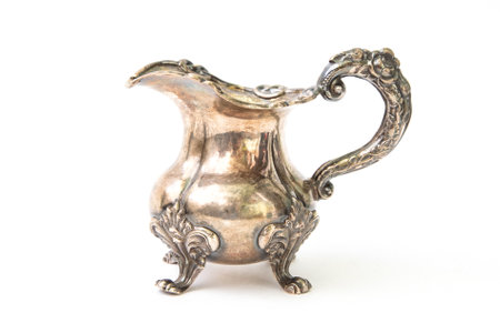 Antique silver jug on white backgroundの写真素材