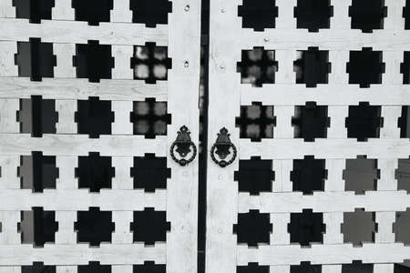 Rare door knobs on wooden gatesの写真素材