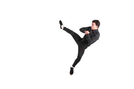 Kick roundhouse kick jumping isolated on white background for any purposeの写真素材
