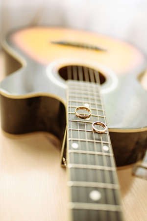 Wedding rings on guitar strings for all purposesの写真素材