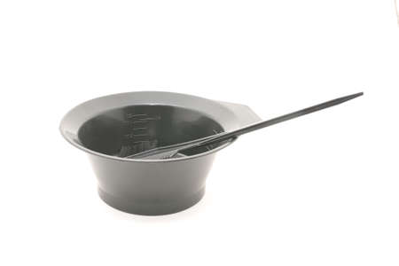 Bowl with a brush, for hair dye. Isolated on white background for any purposeの写真素材