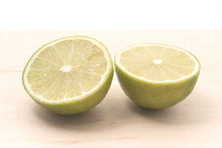 Fresh lime cut on a board for any purposeの写真素材