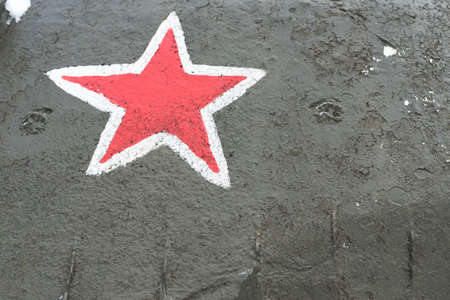 Red star on Board the old tank for any purposeの写真素材
