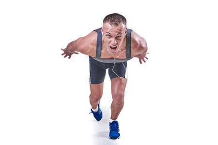 Handsome man at the start in sportswear isolated on white background for any purposeの写真素材