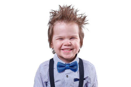 Little handsome boy in bow tie smiling for any purposeの写真素材