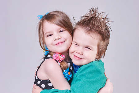 Beautiful little boy and girl cute hugging, for any purpose
