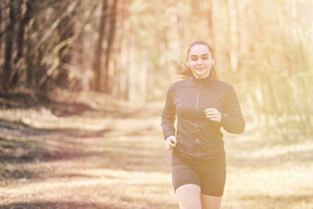 Sporty girl in the woods, for any purposeの写真素材