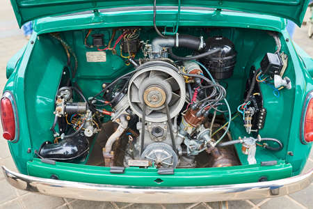 The engine of an old small car, in the back for any purposeの写真素材