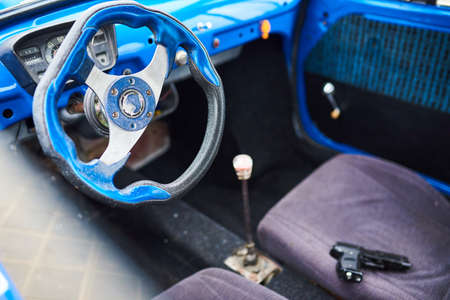 Gun in the front seat of the car for any purposeの写真素材