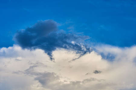 White feathery, volumetric clouds. With the sun. For any purposeの写真素材