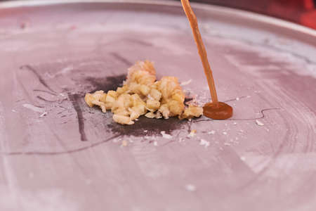 The cooking process fried Thai ice cream on the street.の写真素材