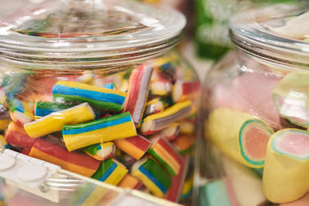 Banks with multi-colored marmalade, background texture. For all purposesの写真素材