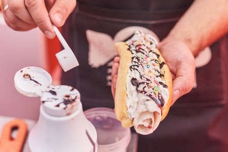 The course dog with fried Thai ice cream on the street.