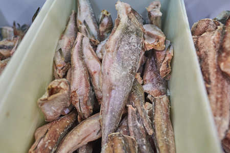 Frozen hake in the supermarket fridge. For all purposes