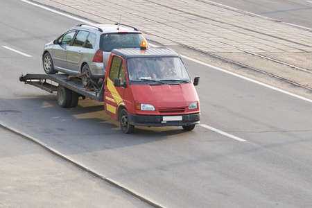 Red tow truck driven car for any purposeの写真素材
