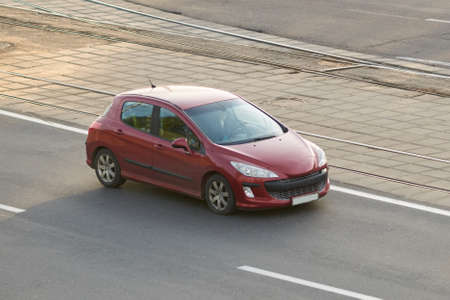 Passenger car red in the city for any purpose
