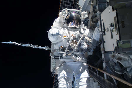 Tied astronaut in outer space on a space station. Elements of this image were furnished by NASA for any purposeの写真素材