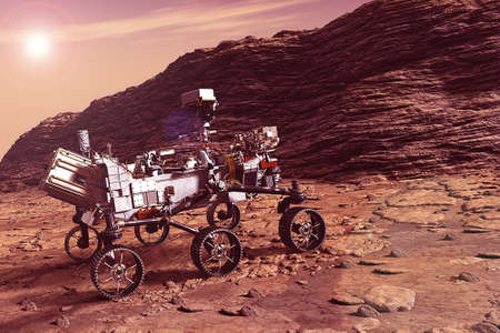 The rover explores the mountains and plains. with the sun on the horizon. Elements of this image were furnished by NASA. For any purpose.の写真素材