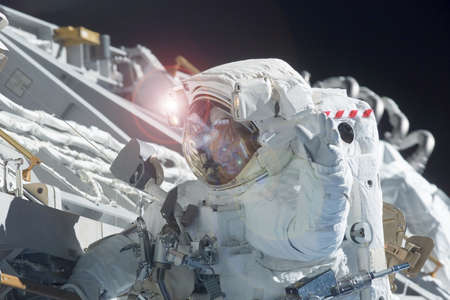 Astronaut in outer space in a spacesuit. At the space station. Elements of this image were furnished...