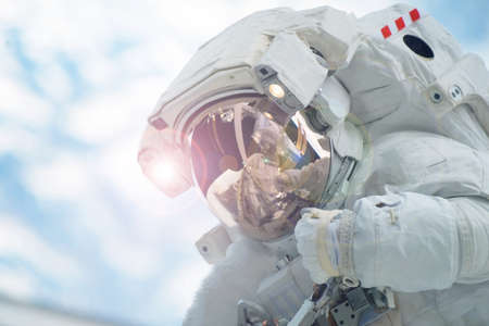 Astronaut in outer space in a spacesuit. Elements of this image were furnished by NASA. For any...