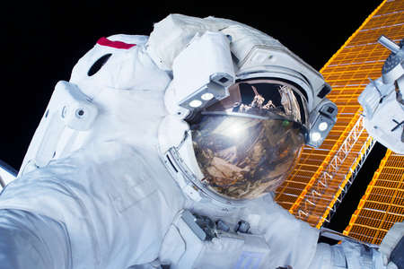Astronaut in open space above the planet.