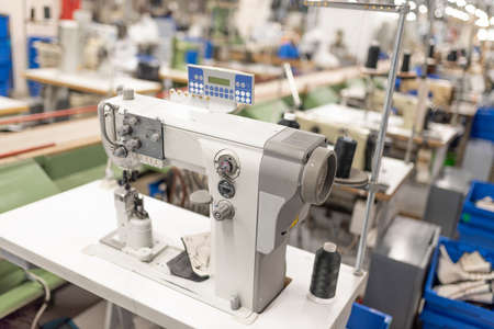 Industrial sewing machine in the work shop. Shoe manufacturing. For any purpose.