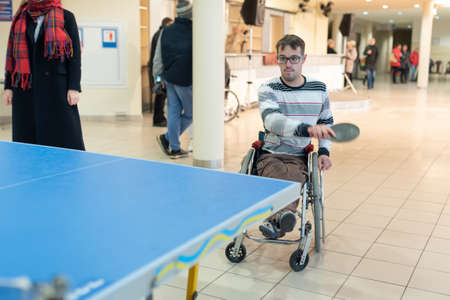 Vitebsk, Belarus -November 17, 2019. A disabled person plays table tennis. For any purpose.のeditorial素材