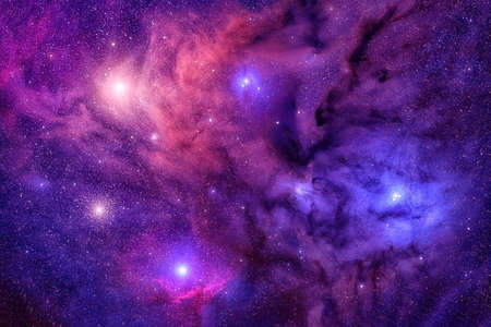 A beautiful distant galaxy in bright colors, with stars.