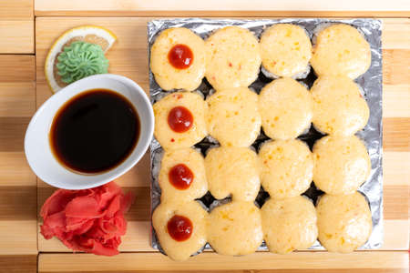 A large set of baked rolls with cheese caps. For any purpose.