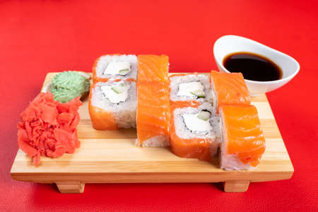 Philadelphia roll with various fillings. with ginger and wasabi. For any purpose.