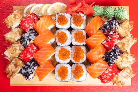 Sushi set of rolls and poppies, with salmon and caviar. With tuna and krill California and Philadelphia. Close-up. For any purpose.の写真素材