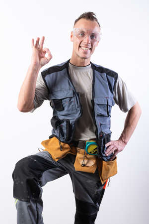 The builder shows the sign okay. For any purpose.の写真素材