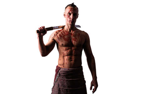 Athletic man with a sword on his shoulder. in the blood of the enemy. Blocks blows. Isolated on a...