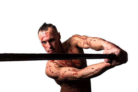 A man with a bare torso, in the blood of the enemy. He wants to strike. Isolated on a white...