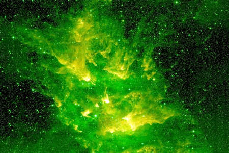Green cosmic nebula with bright areas and stars.の写真素材