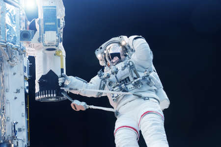 Astronaut in outer space at the space station.