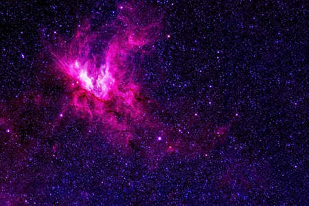 A pink galaxy in deep space.