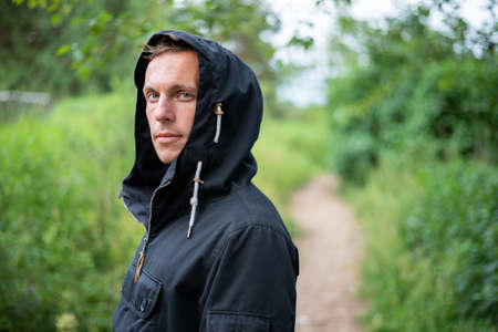 A man in the cold season, in the forest. For any purpose.