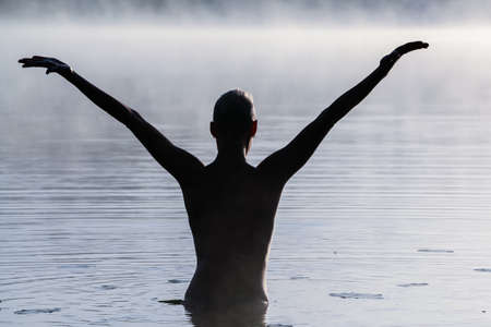 The woman on the lake, at dawn in the fog. For any purpose.の写真素材