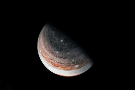 Saturn in unusual colors, on a dark background.の写真素材
