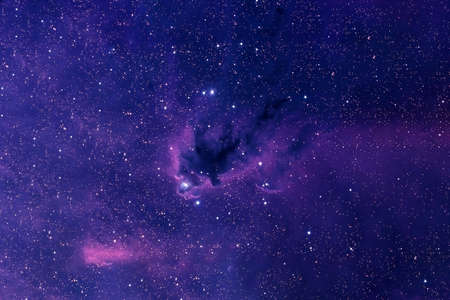 A blue galaxy with stars in deep space.の写真素材