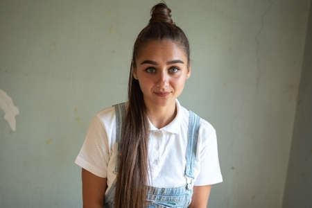 Girl in an abandoned house with long hair. Hight quality photoの写真素材