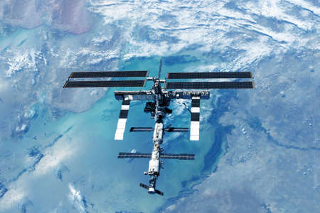 ISS over the planet, against the background of clouds.