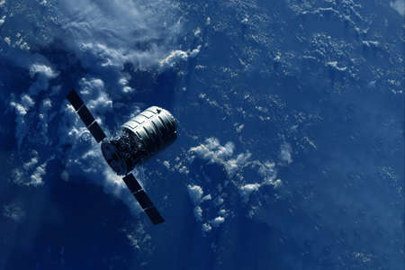 Spaceship above the earth.  high quality photoの写真素材