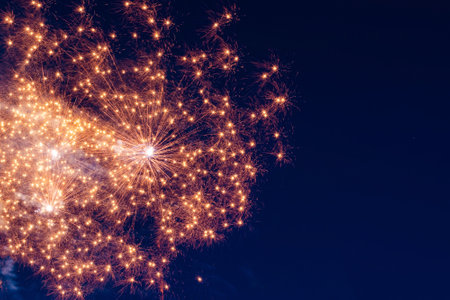 Bright, fiery fireworks against the background of the night sky.の写真素材