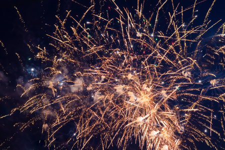 Bright, pink fireworks against the background of the night sky.の写真素材
