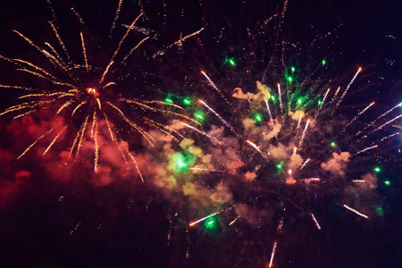 Beautiful multi-colored fireworks against the background of the night sky.の写真素材