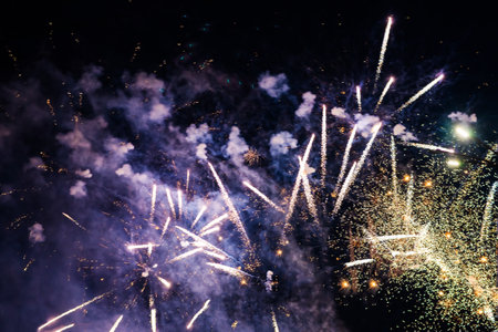 Bright light flash of fireworks, against the background of the night sky. high quality photoの写真素材