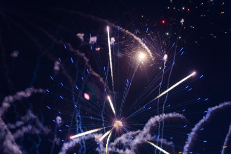 Bright light flash of fireworks, against the background of the night sky. high quality photo
